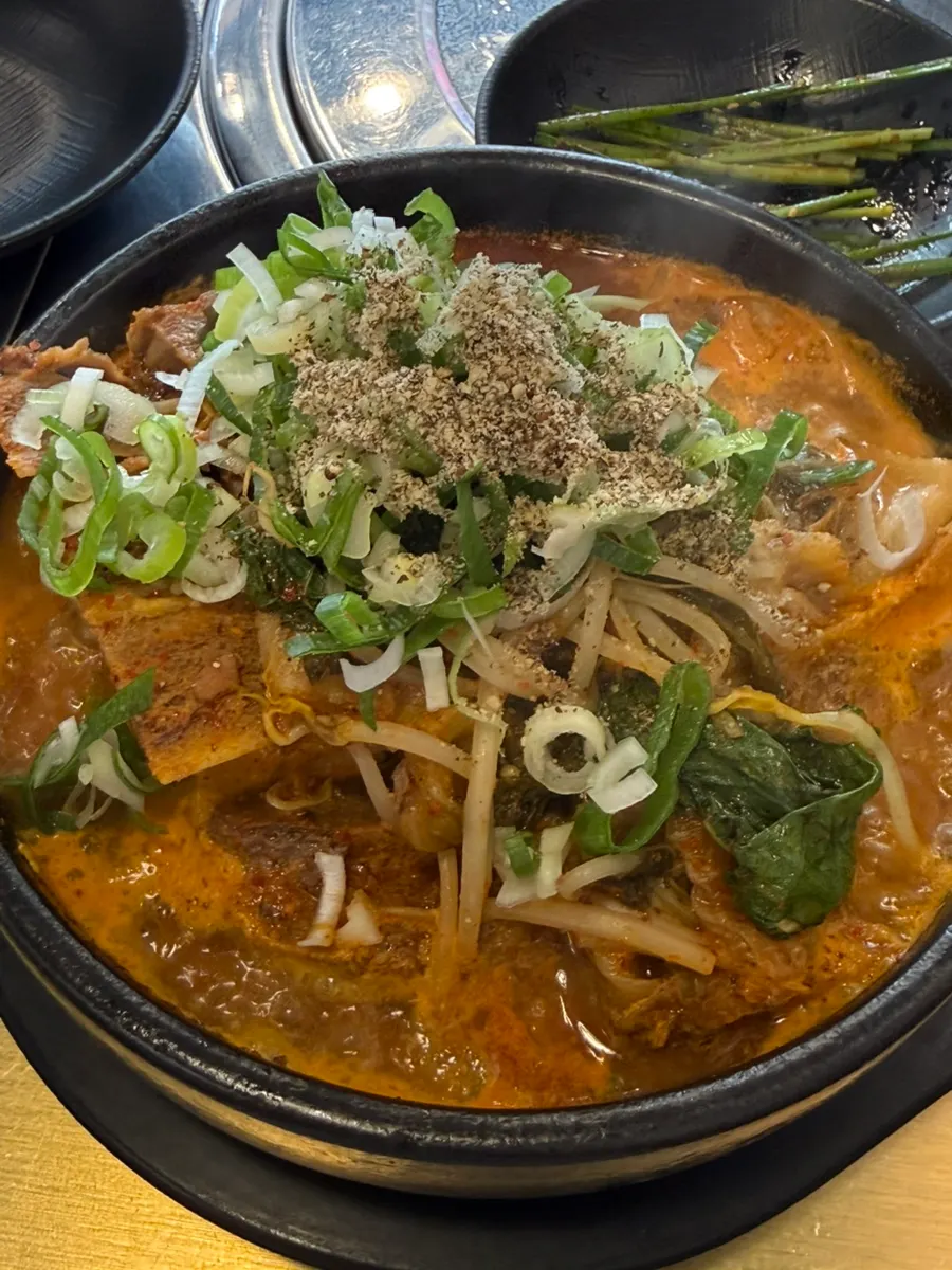 Haejangguk topped with bean sprouts and perilla seed powder