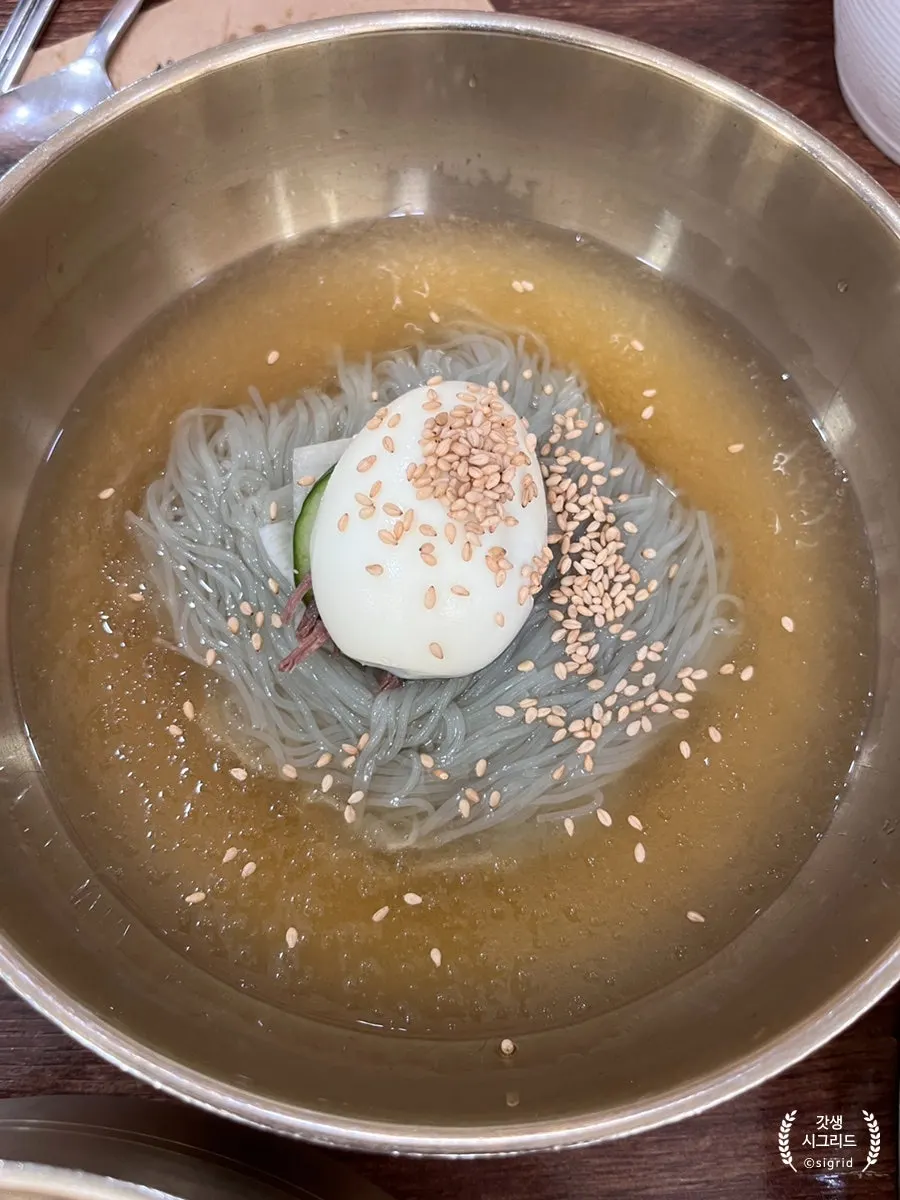 Lifting a bundle of naengmyeon noodles