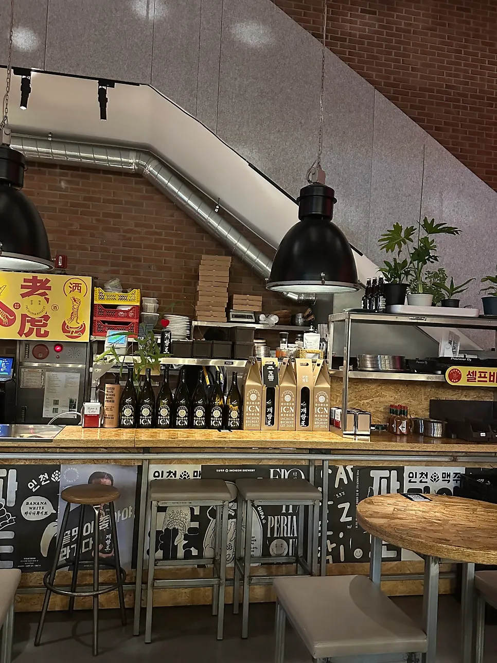 Open kitchen and bar seating inside Incheon Beer Tiger
