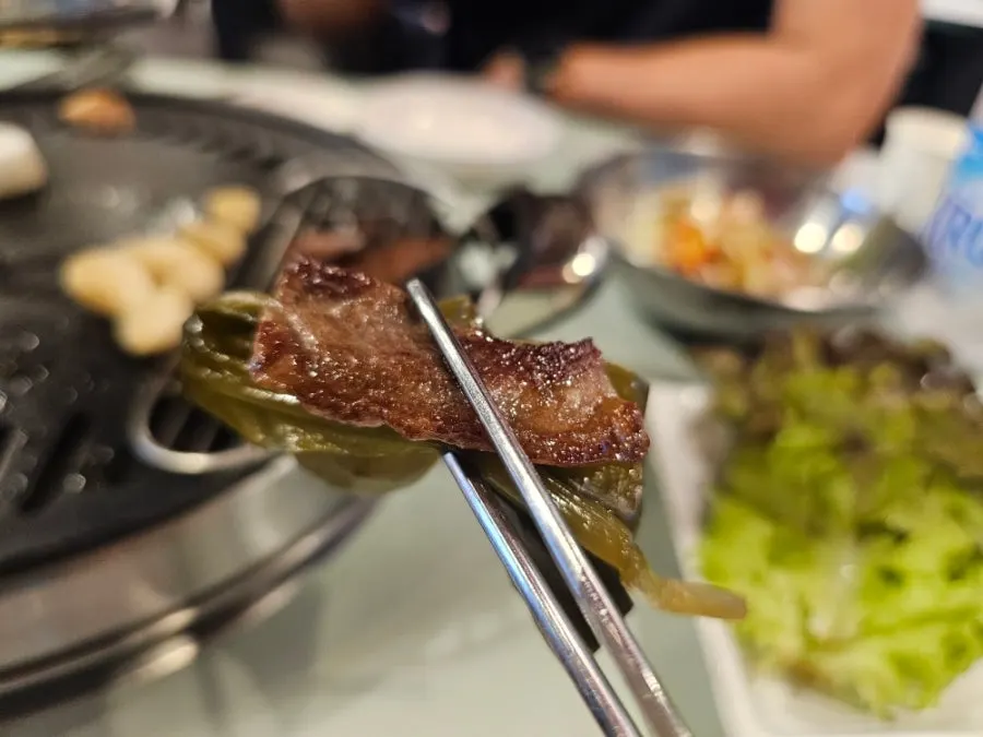Grilling brisket point on the stone plate