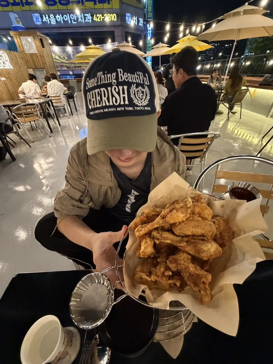 Chicken and drinks on a rooftop terrace table