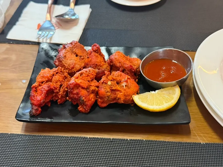A plate of tandoor-roasted tandoori chicken