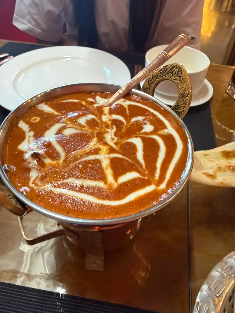 A curry plate set over a candle warmer