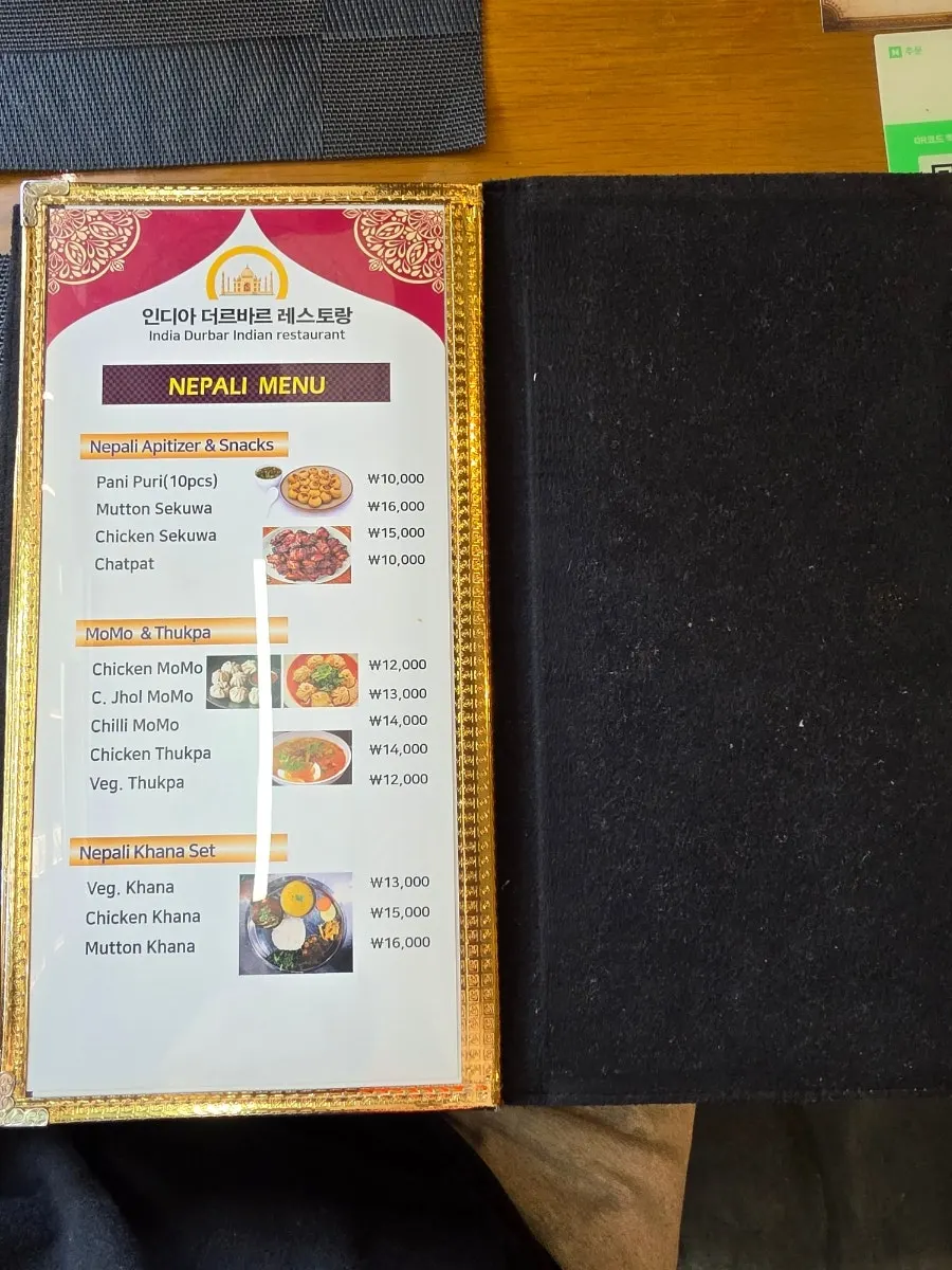 Menu board listing lunch sets and 1- or 2-person sets