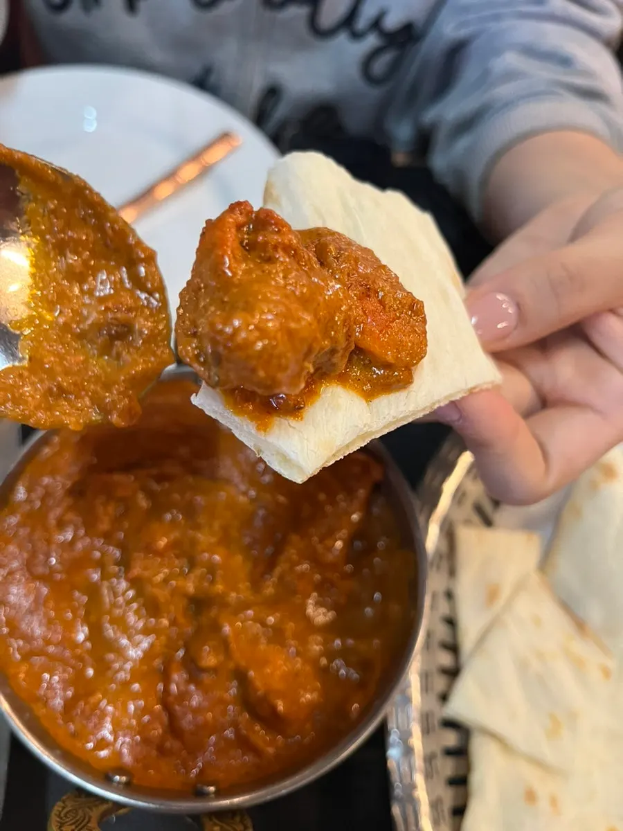 Curry spooned over rice
