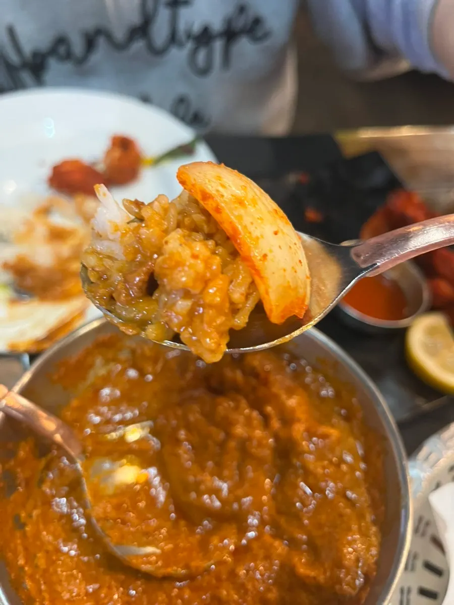 Curry with tandoori chicken pieces inside