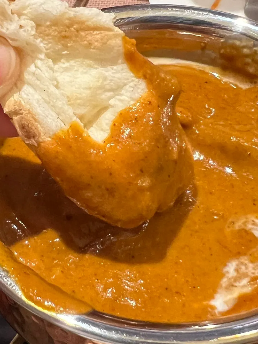 Curry bowl being kept warm on solid fuel
