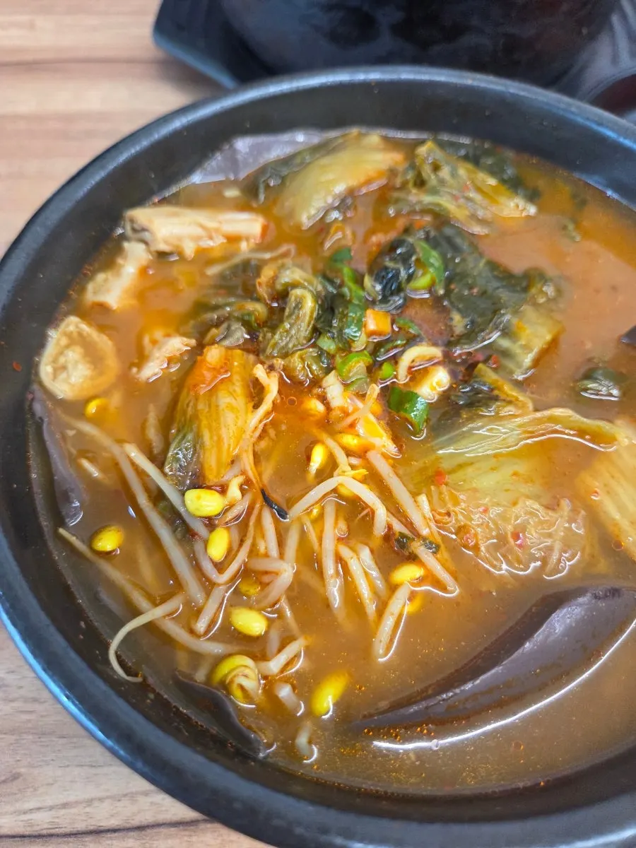 Close-up of broth with blood sausage and tripe