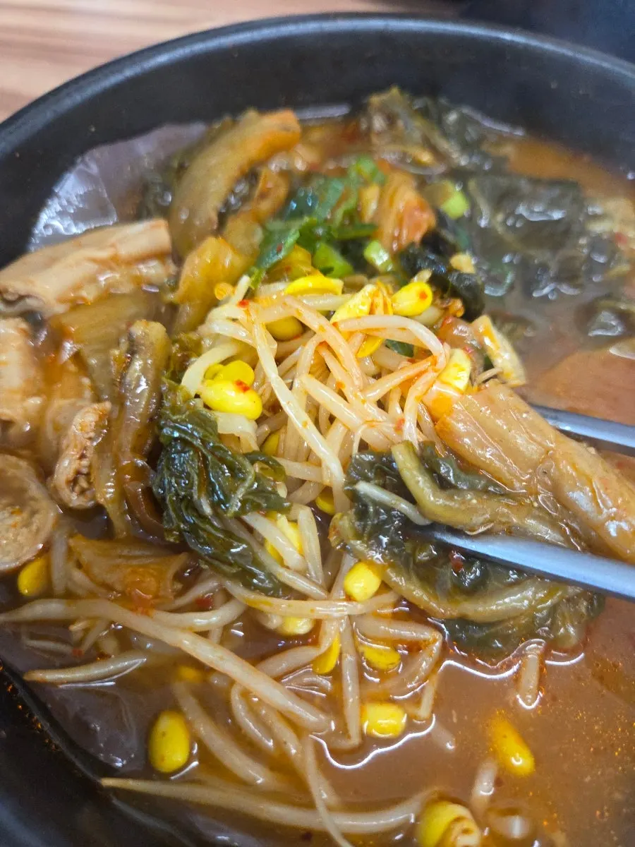 Haejangguk filled with bean sprouts, napa cabbage, and enoki mushrooms