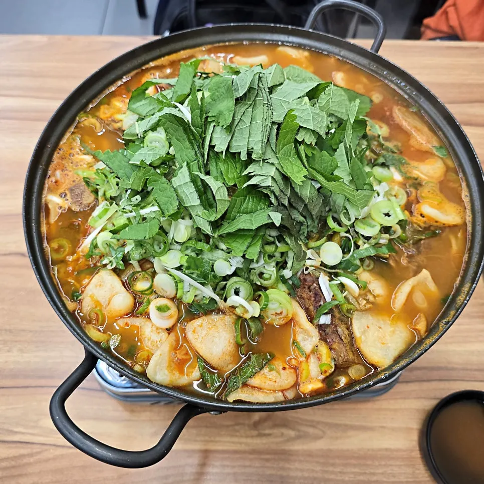 Medium bone hot pot pot placed on the burner