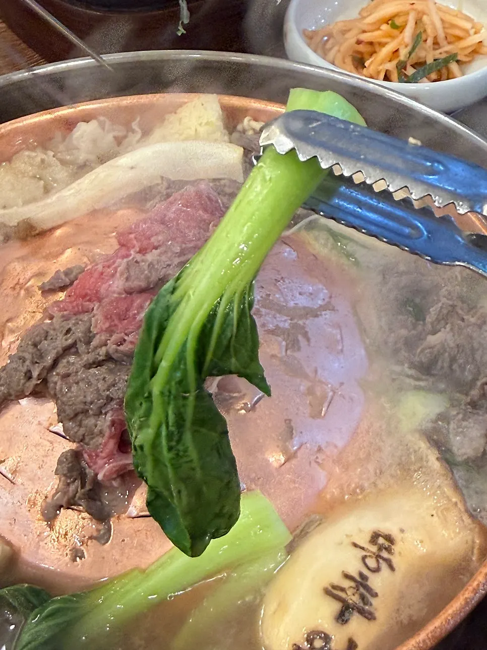 Korean beef bulgogi enjoyed in broth