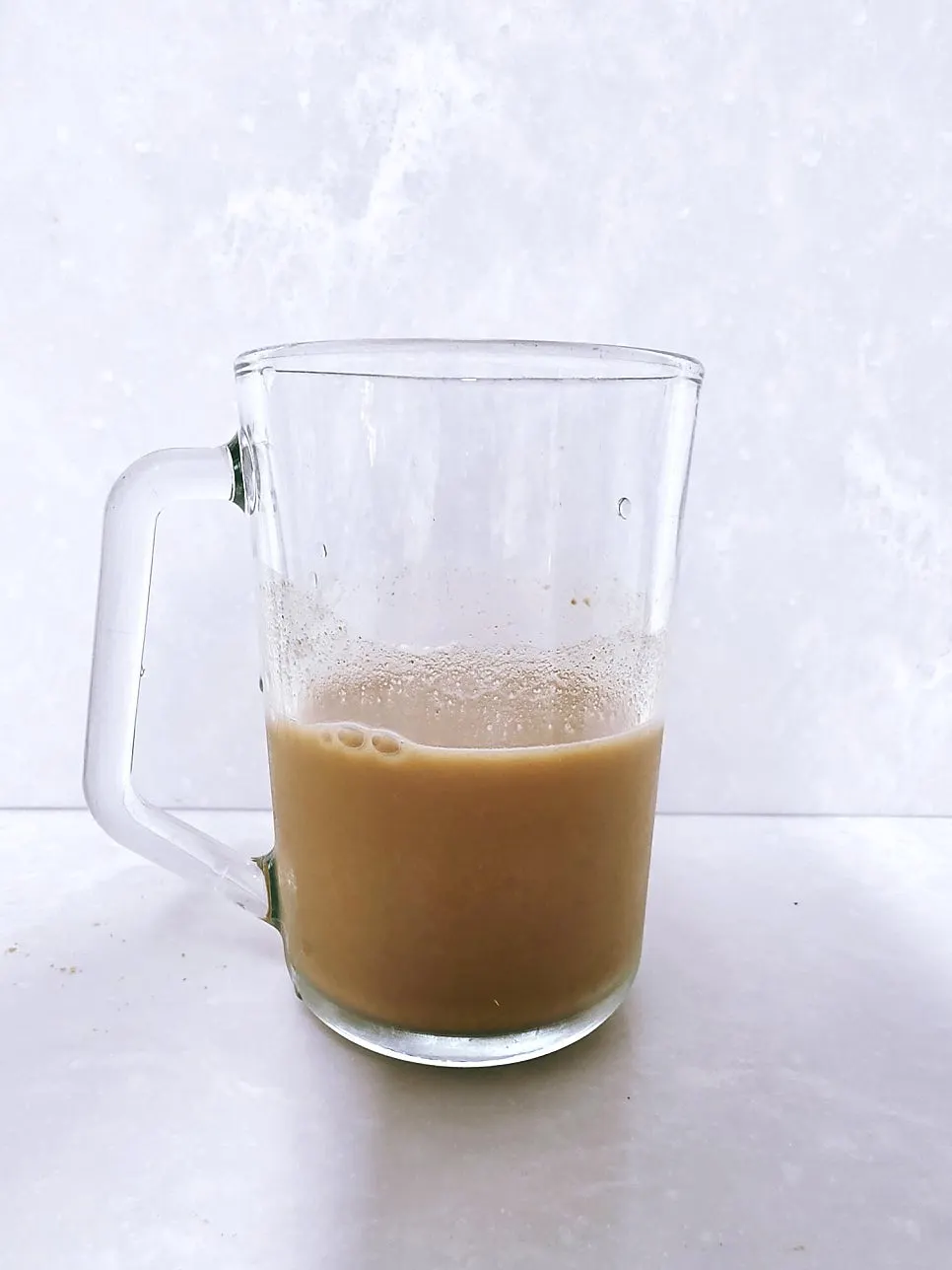 A cup of injeolmi soy milk mixed without shaking