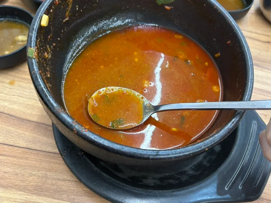 An empty bowl of pork bone soup finished down to the scraps