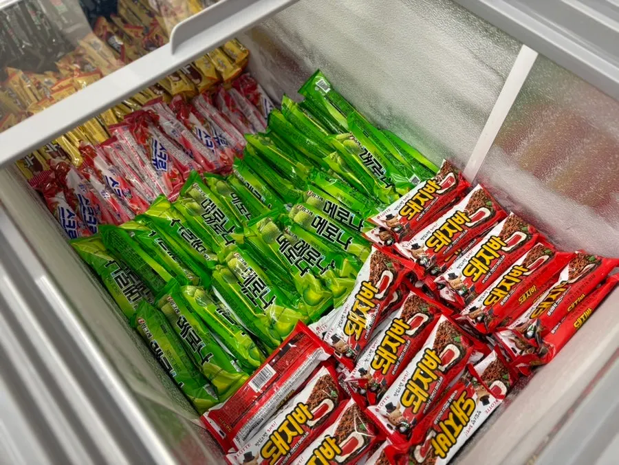Freezer full of assorted popsicles