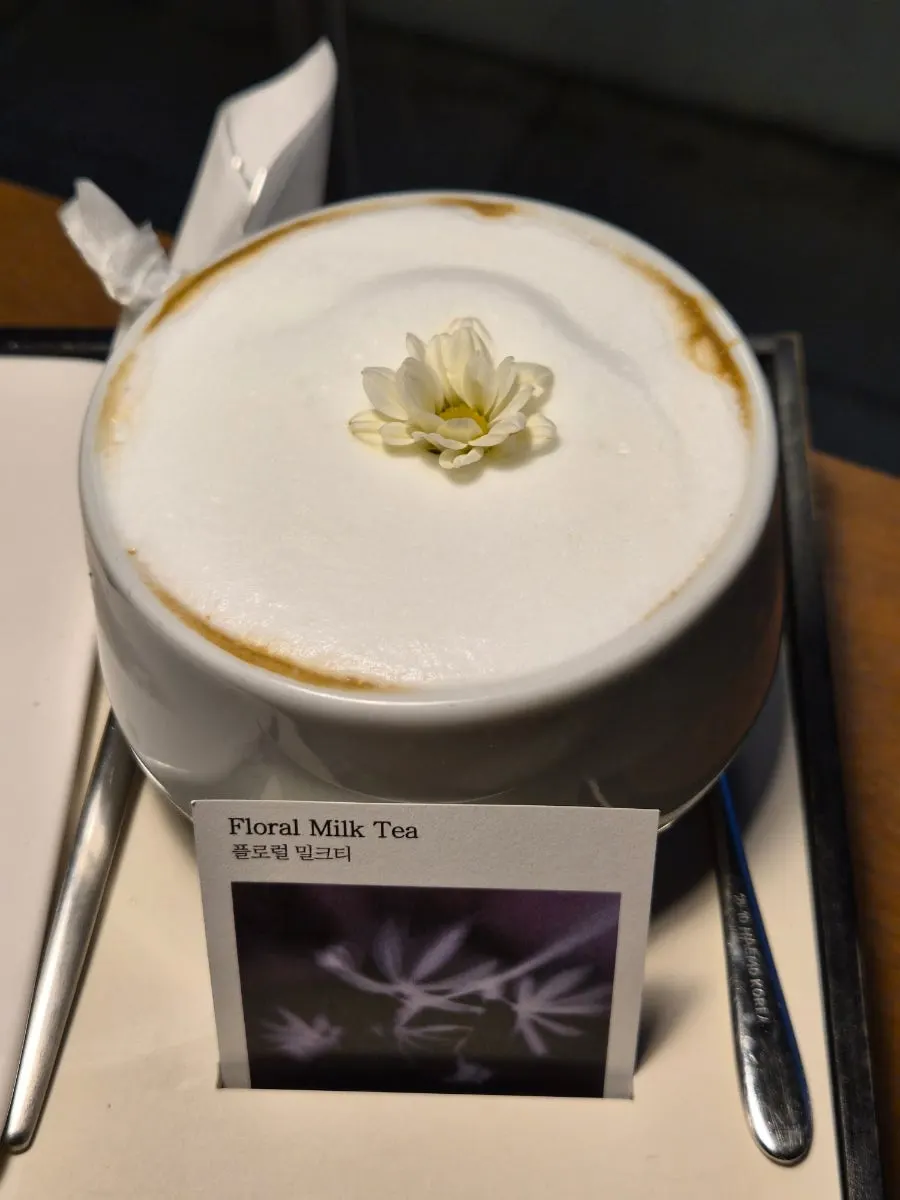 Floral milk tea at Naemyeonui Balgyeon topped with a small flower