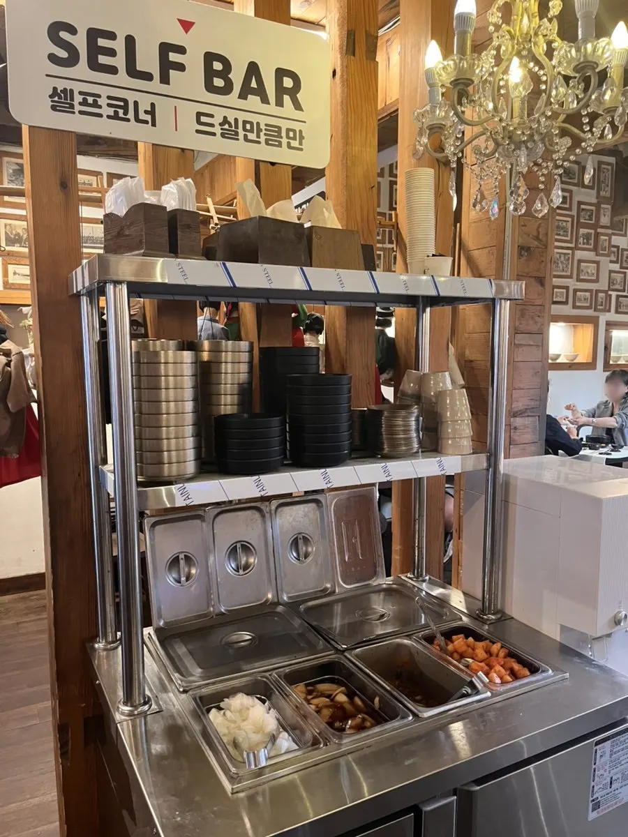 Self-bar with small plates, pickles, yeolmu kimchi, and kkakdugi