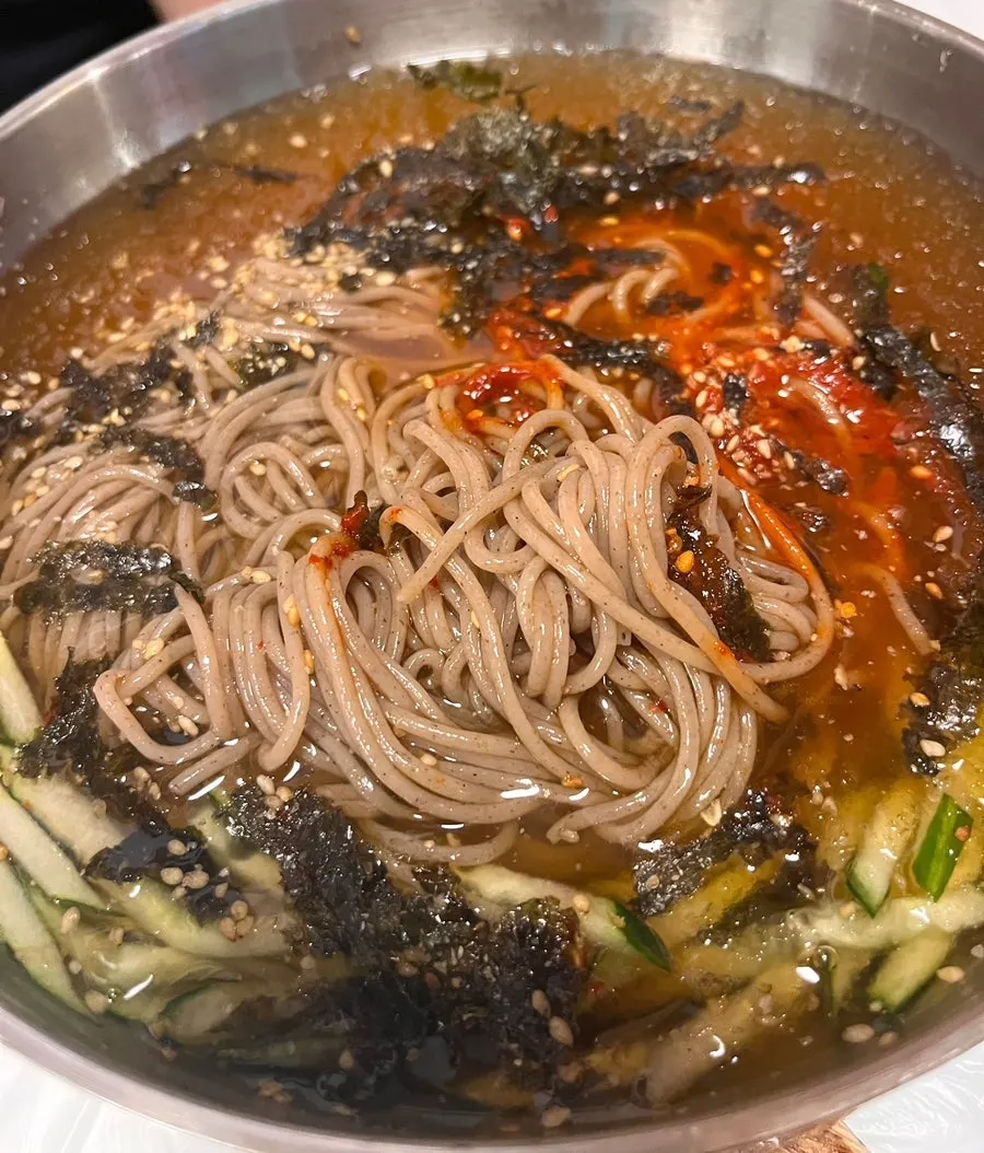 The 2-person set spread of makguksu dishes