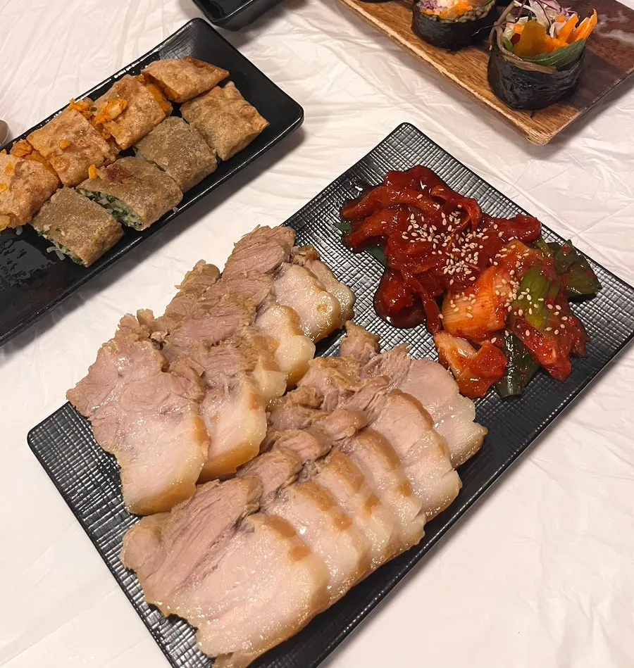 Table set with bossam and makguksu together
