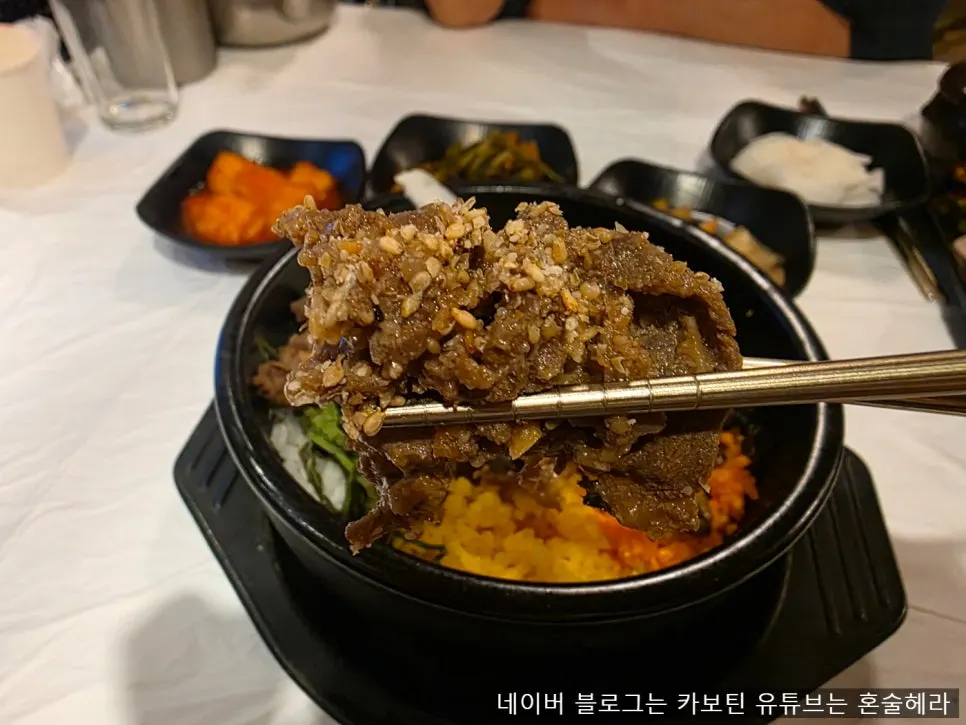 Full spread of beef bulgogi stone bowl bibimbap