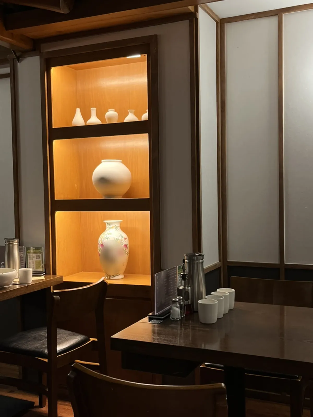 Interior with moon jars fitting the Asian-style decor