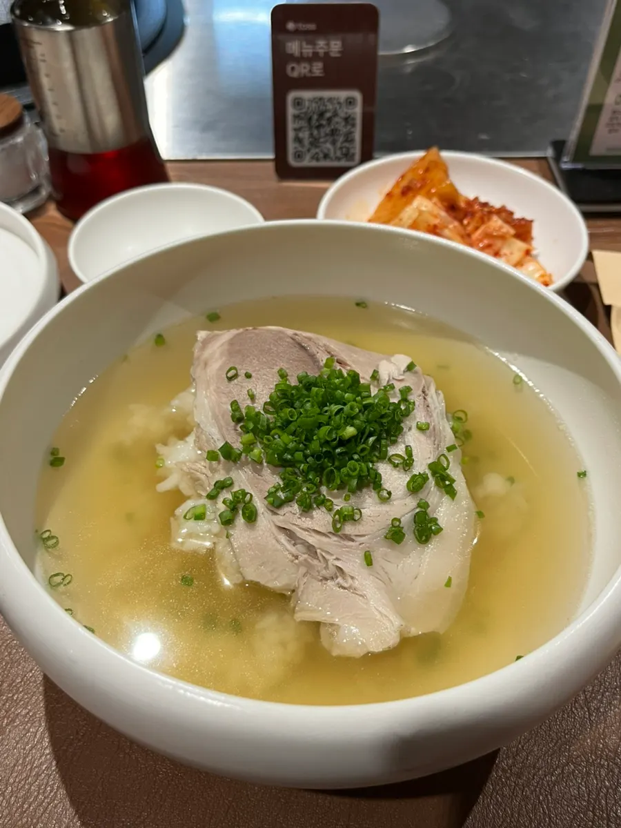 A bowl of Wolhadong Gomtang in white ceramic
