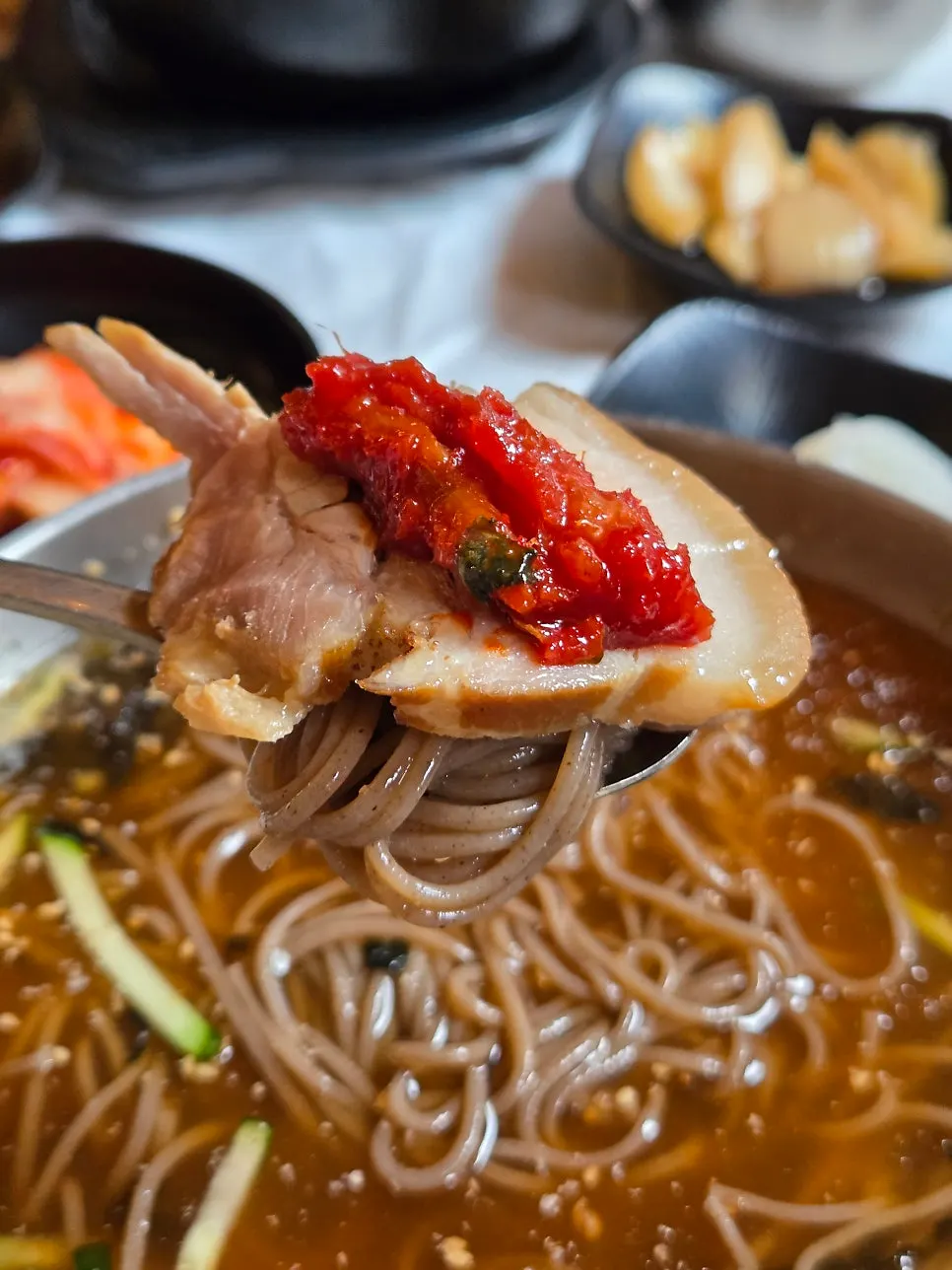 Close-up of springy buckwheat noodles and deep broth