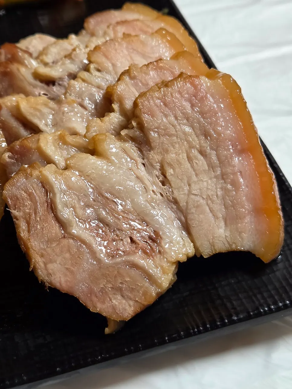 Close-up of a moist, tender piece of bossam