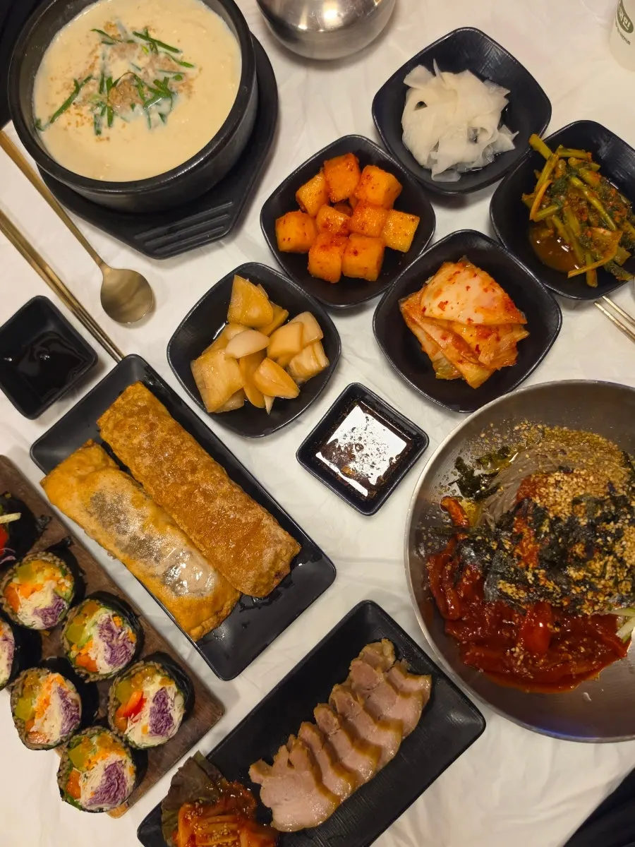 Neatly plated table spread of ordered dishes