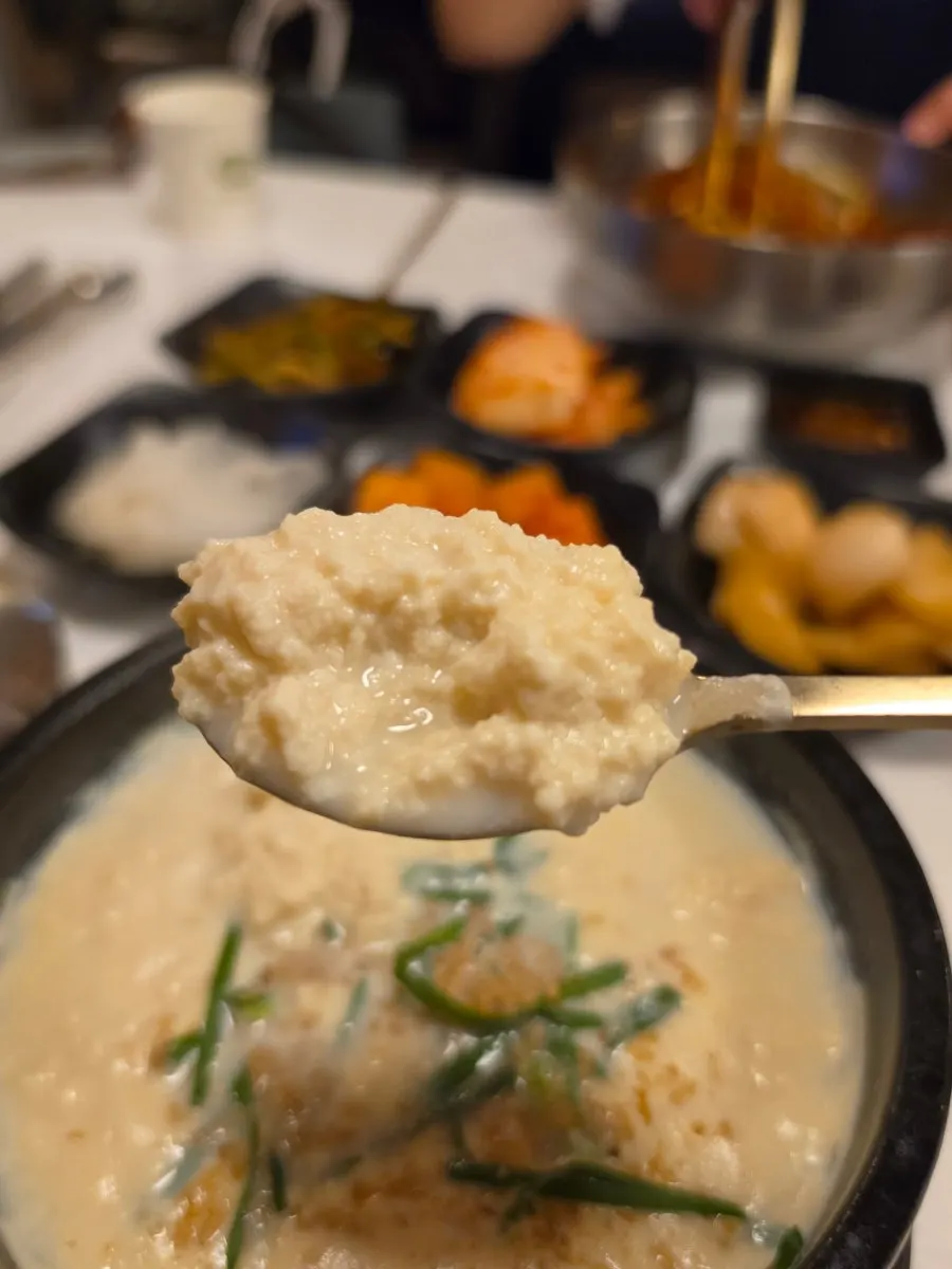 A spoonful of soft, cloud-like chodang sundubu