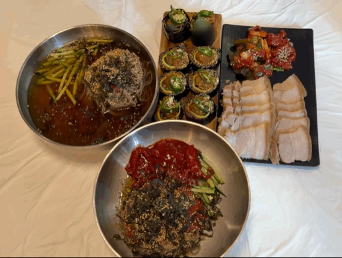 2-person set with water makguksu, bibim makguksu, and bossam laid out