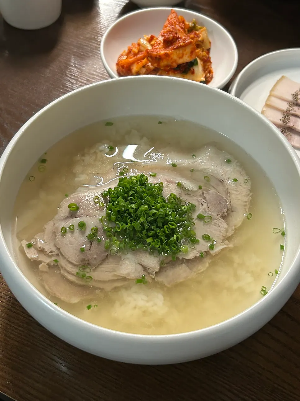 Dipping cold jeyuk into the sauce