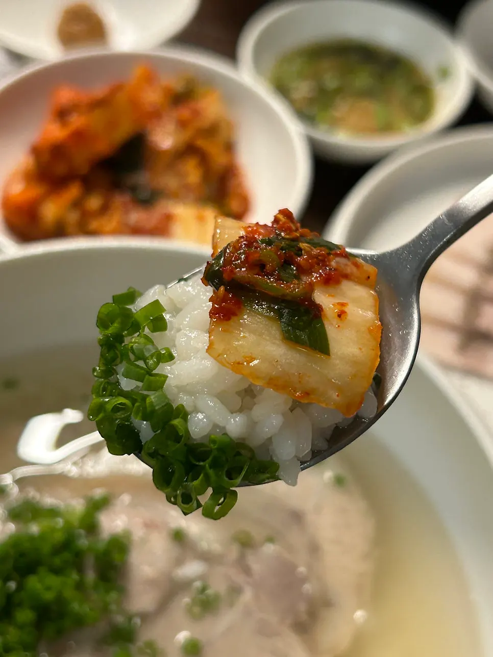 A spoonful of the gomtang broth