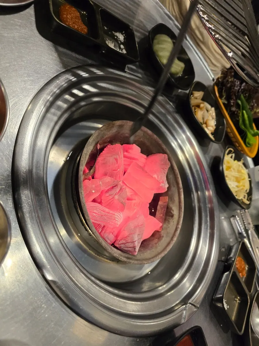 Plate of raw ogyeopsal and tongmokssal as ordered
