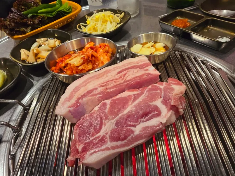 Charcoal grill set with meat ready to cook