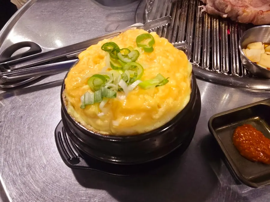 A piece of tongmokssal grilled by staff