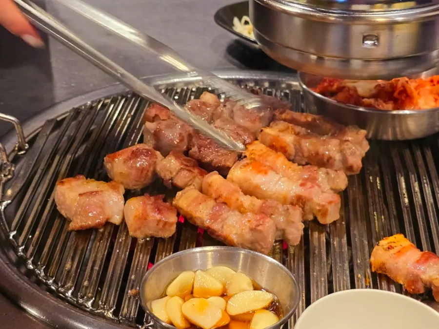 Table spread with the egg dish and grilled meat