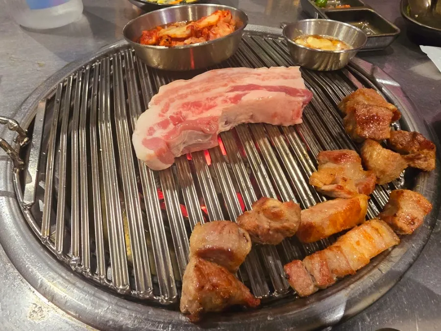 Kimchi and garlic grilling together on the grill