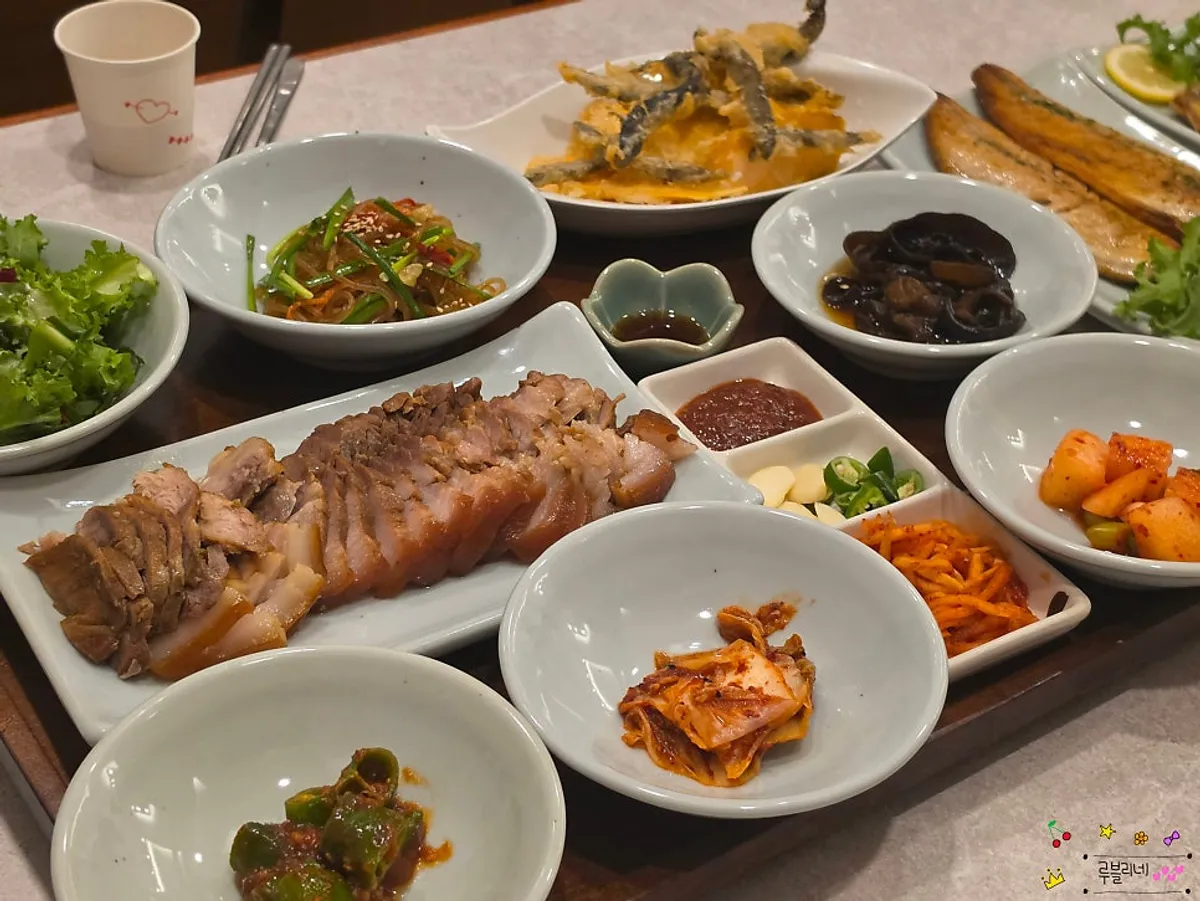 Full table spread of mackerel and boiled pork sanghwang loach soup set