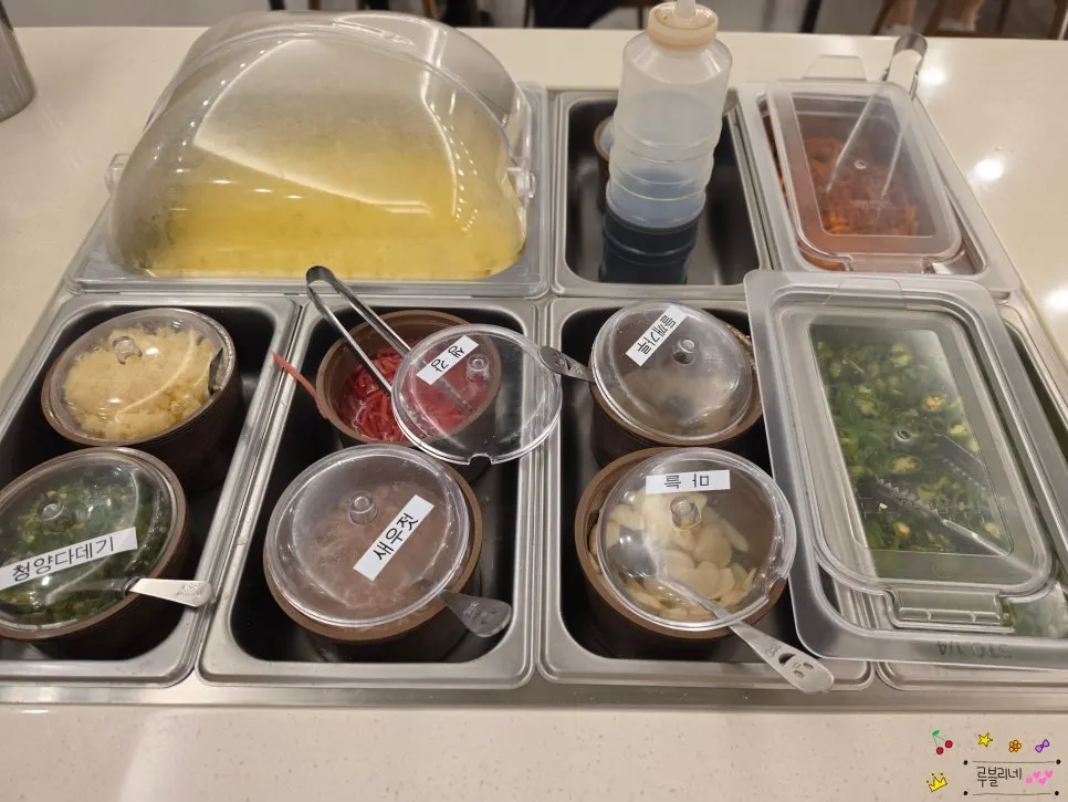 White rice and thin noodles ready at the self-serve bar