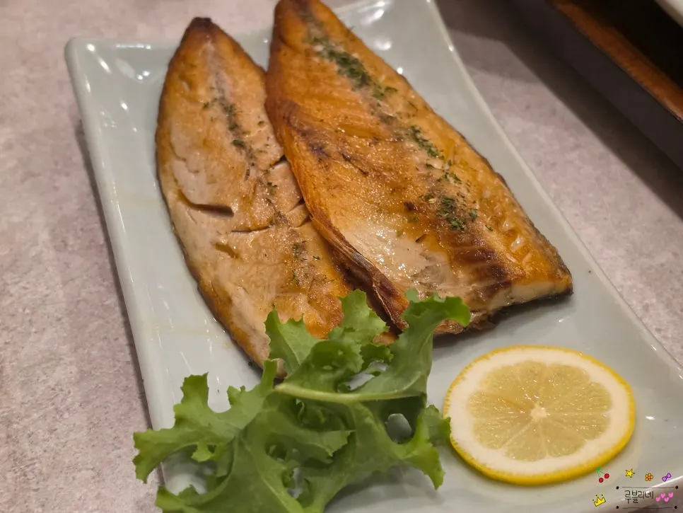 A plate of grilled mackerel with thick, plump flesh