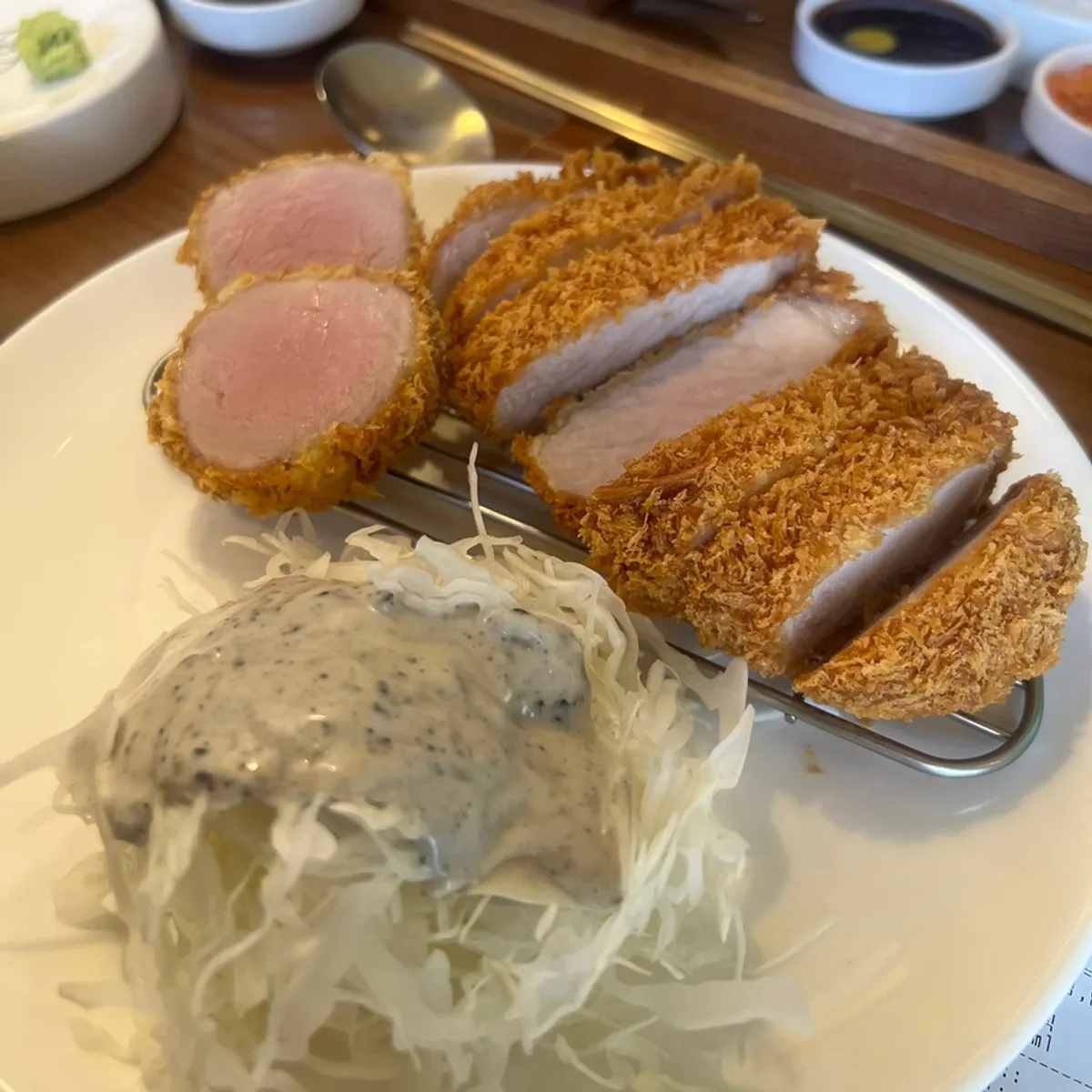 A plate of assorted katsu served on a wire rack