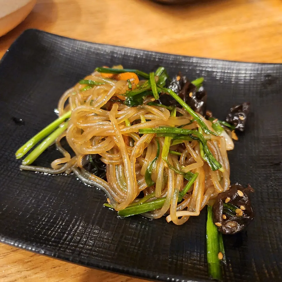 Skate and kimchi among the side dish plates
