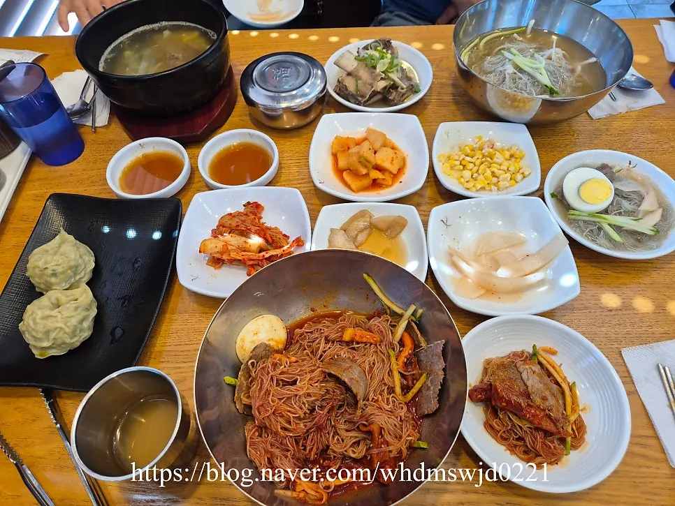 Table set with mul naengmyeon and side dishes