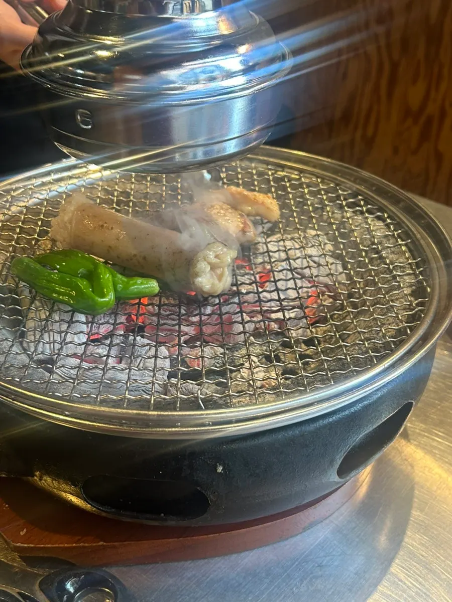 Table setting with two portions of assorted grill