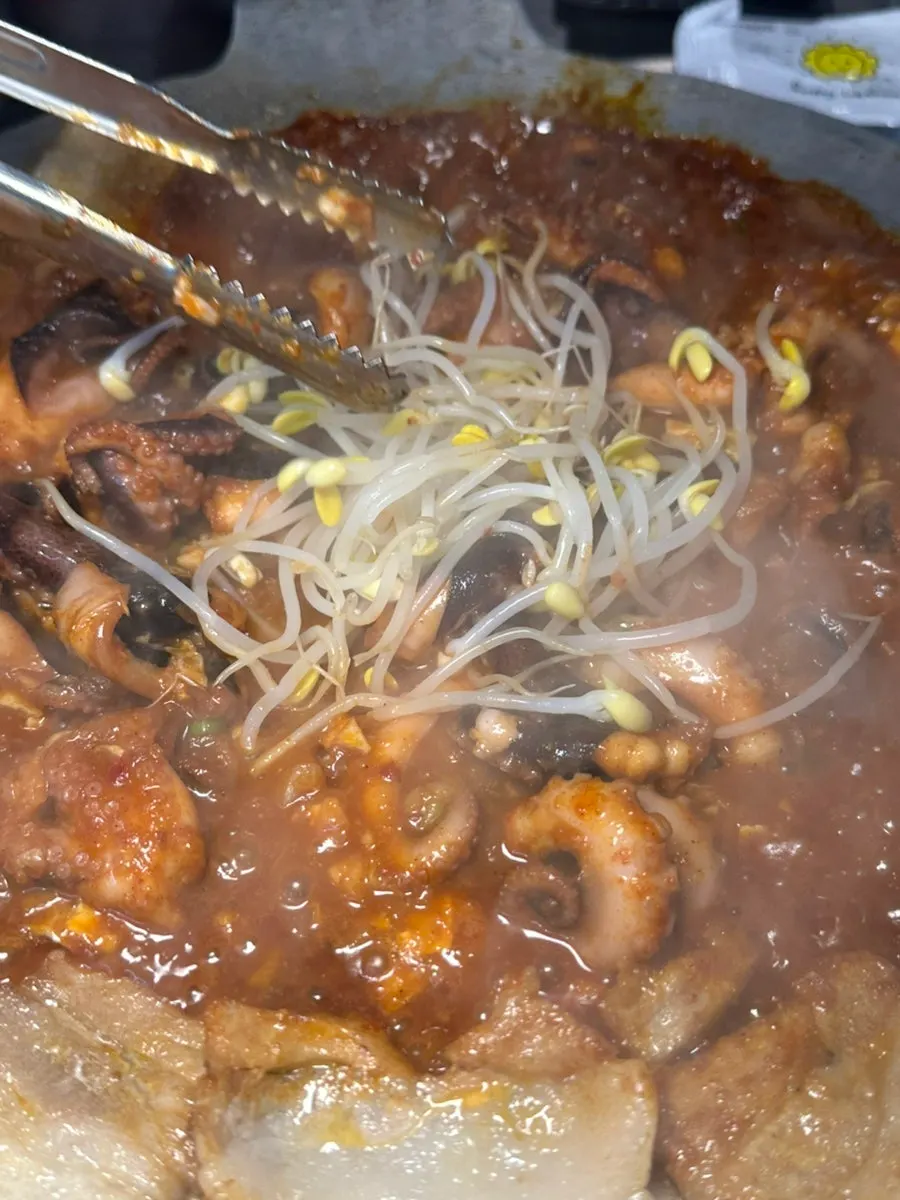 Jjukkumi and pork belly simmering down on the hot plate