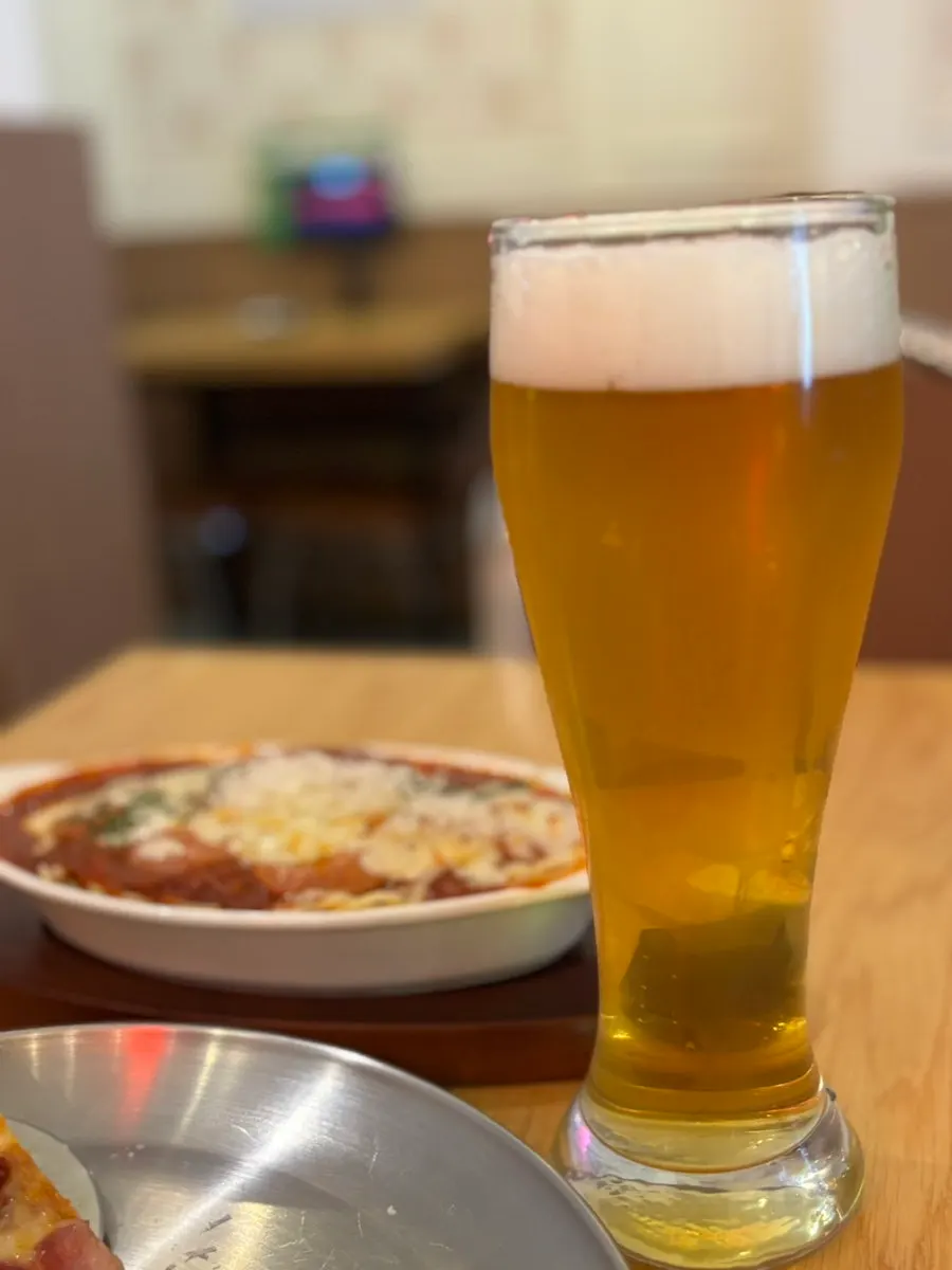 Pizza paired with pilsner lager craft beer