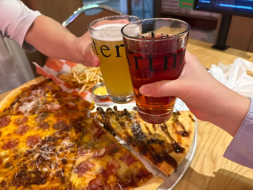 Five kinds of slice pizza and truffle fries served on the table