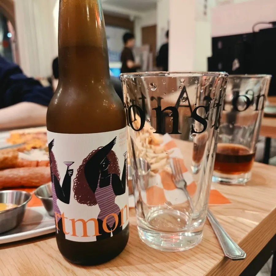 Table with slice pizza and beer together