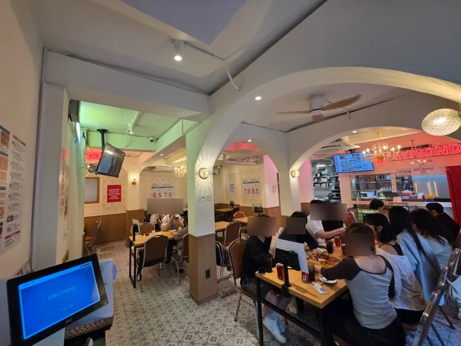Self-service corner with plates and hot sauce