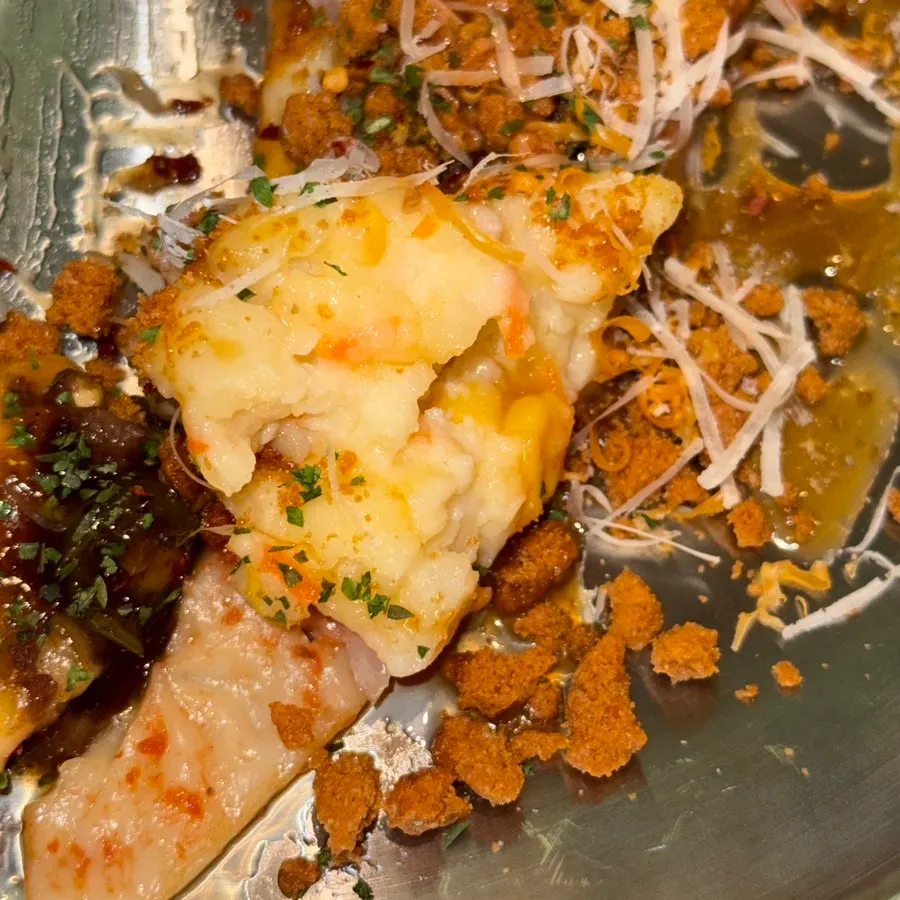 Pizza topped with mashed potato salad and Lotus